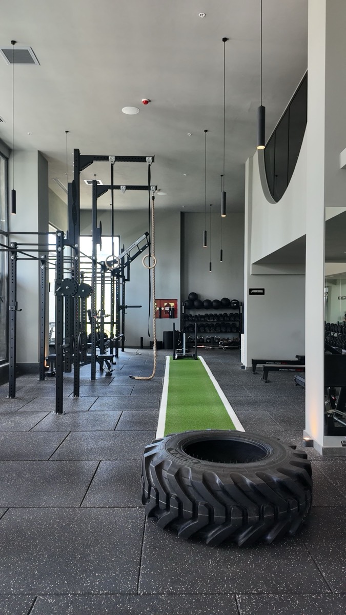 A gym member working out on equipment in a fitness studio